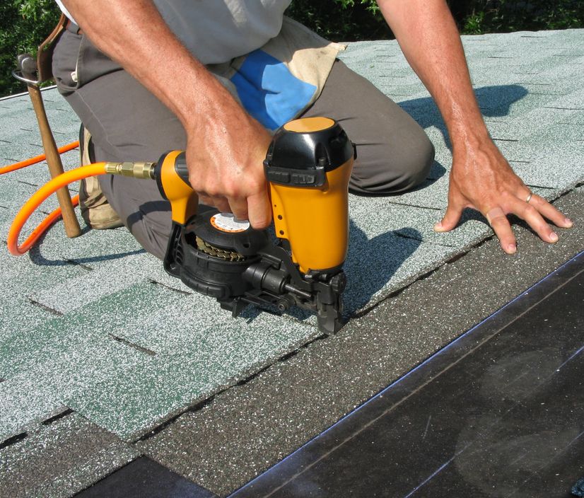 roofing contractors repairing a roof